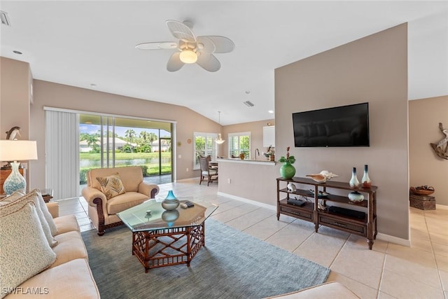 tiled living room with ceiling fan and lofted ceiling