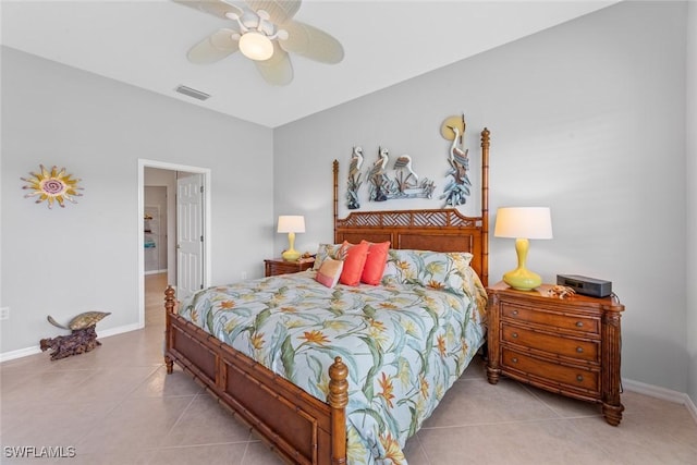 tiled bedroom with ceiling fan