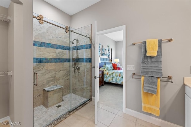 bathroom with tile patterned flooring, vanity, and an enclosed shower