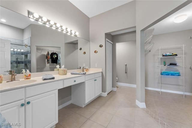 bathroom featuring vanity, tile patterned floors, and an enclosed shower