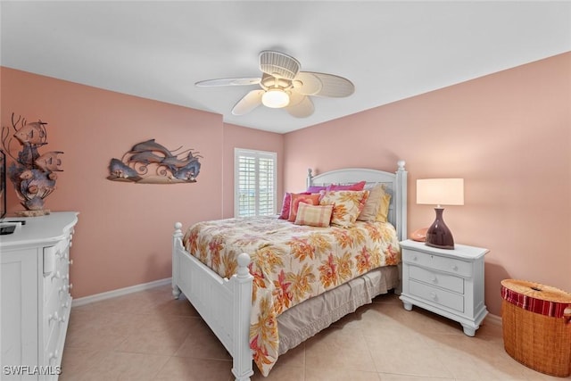 bedroom with ceiling fan and light tile patterned floors