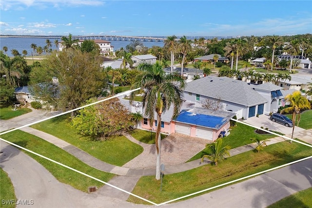 birds eye view of property featuring a water view