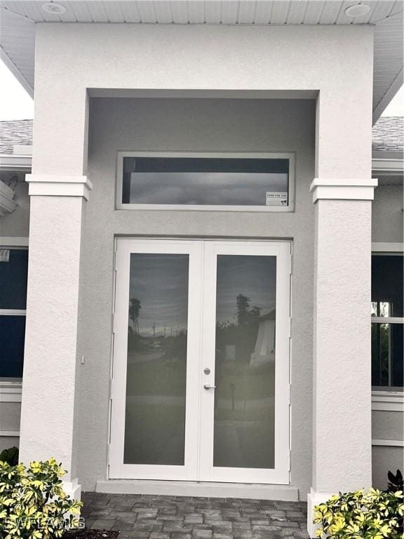 entrance to property featuring french doors