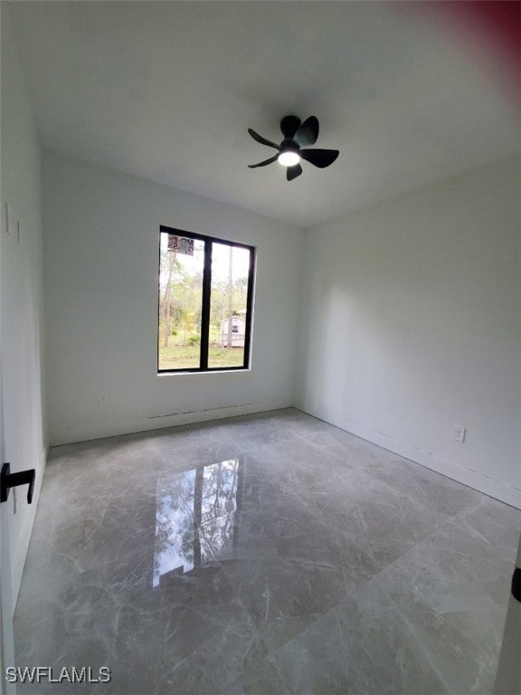 empty room featuring ceiling fan