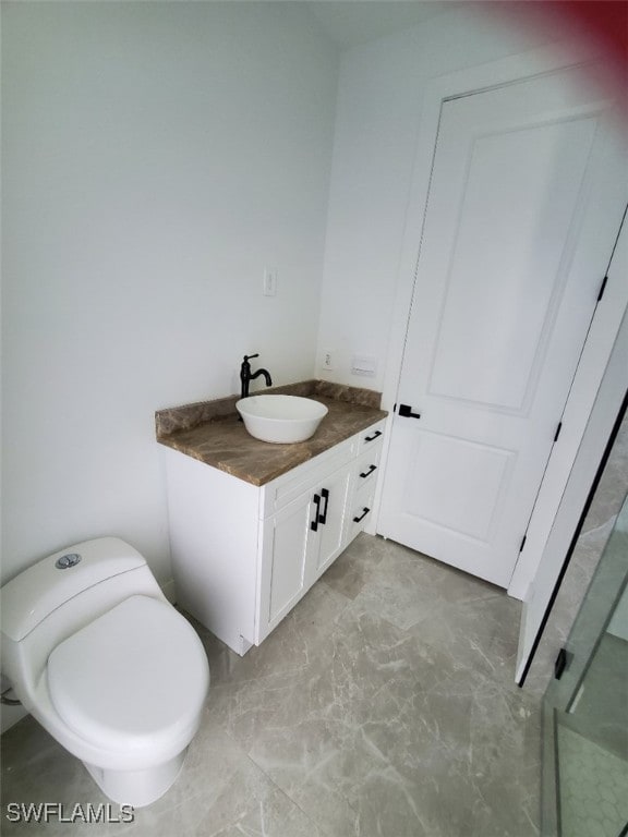 bathroom with vanity and toilet