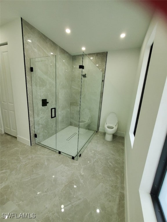 bathroom with an enclosed shower and toilet