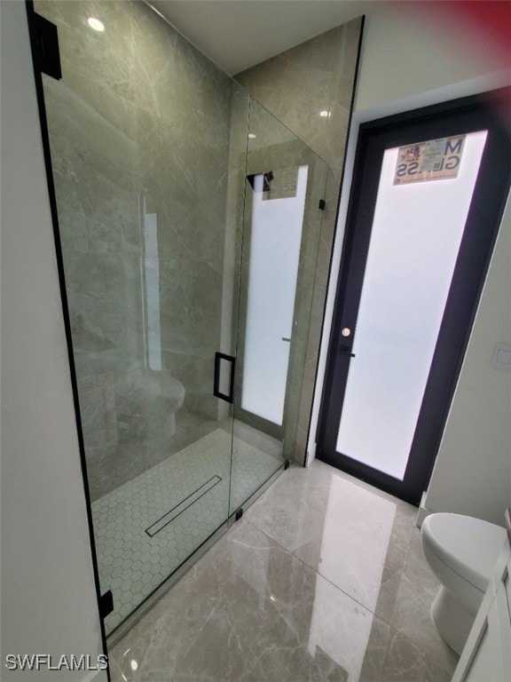 bathroom with toilet and walk in shower