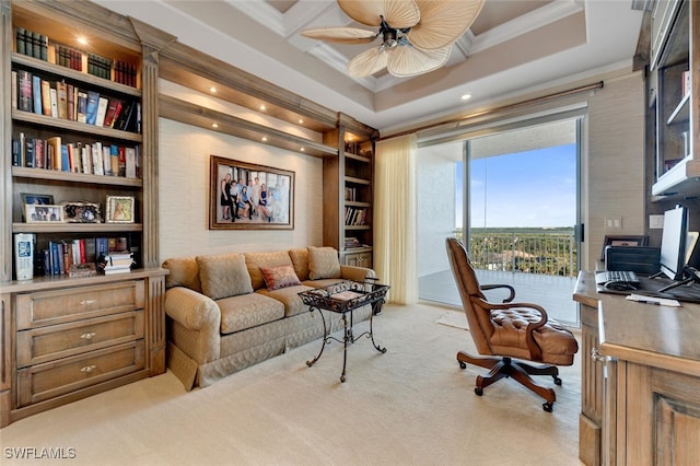 home office with ornamental molding, coffered ceiling, light colored carpet, ceiling fan, and built in shelves