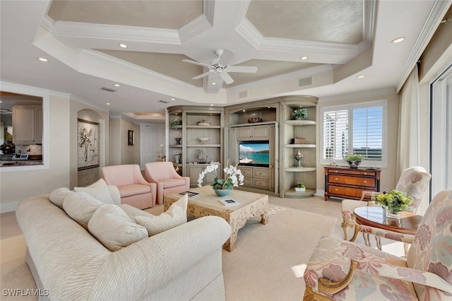 living room featuring ceiling fan, crown molding, and coffered ceiling