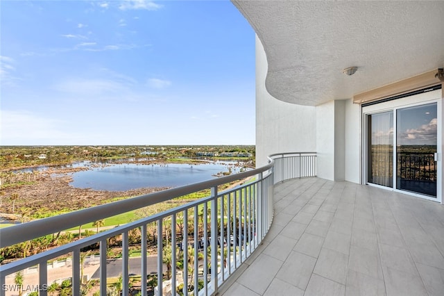 balcony featuring a water view