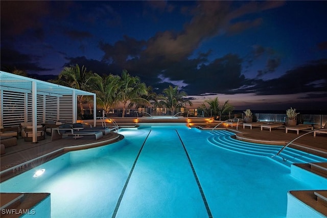 view of pool at dusk