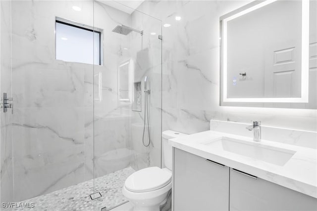 bathroom with vanity, toilet, an enclosed shower, and tile walls