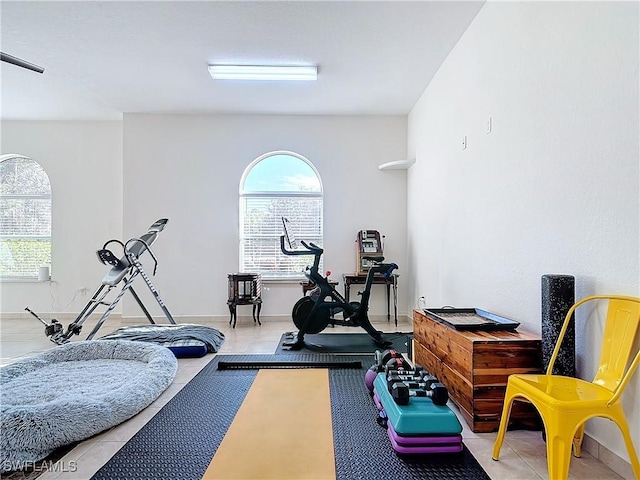 workout room with tile patterned floors