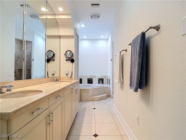 bathroom featuring tile patterned flooring, vanity, and independent shower and bath