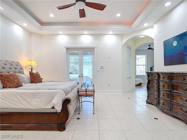 bedroom with access to exterior, light tile patterned floors, french doors, and a raised ceiling