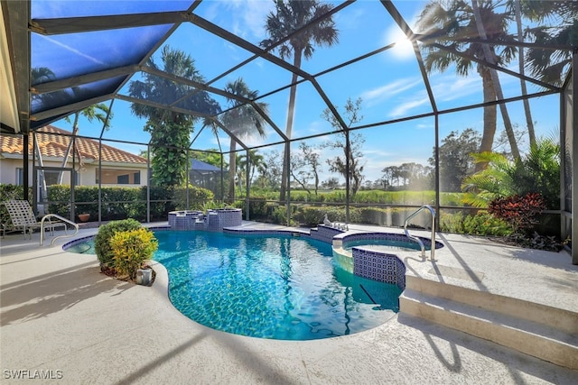 view of swimming pool with a lanai, an in ground hot tub, and a patio