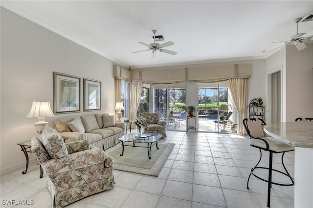 tiled living room with ceiling fan and ornamental molding