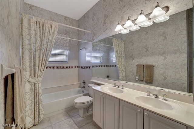 full bathroom featuring toilet, vanity, tile patterned flooring, and shower / tub combo with curtain