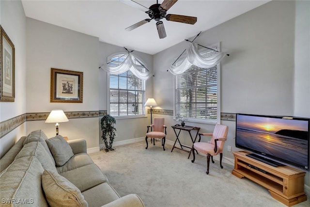 living room featuring light carpet and ceiling fan