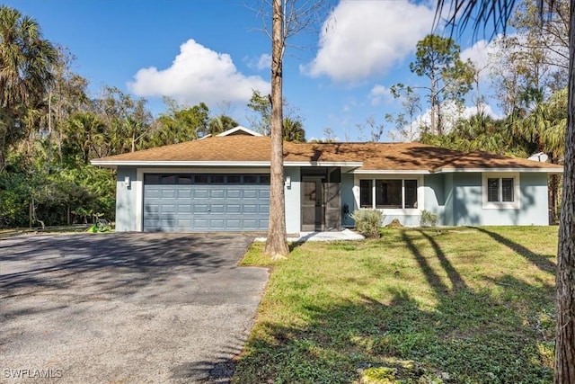 ranch-style house featuring a front lawn, stucco siding, driveway, and an attached garage