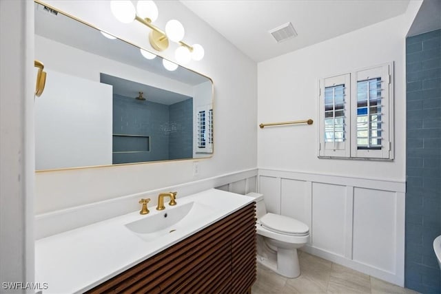 full bath with vanity, toilet, visible vents, walk in shower, and tile patterned flooring