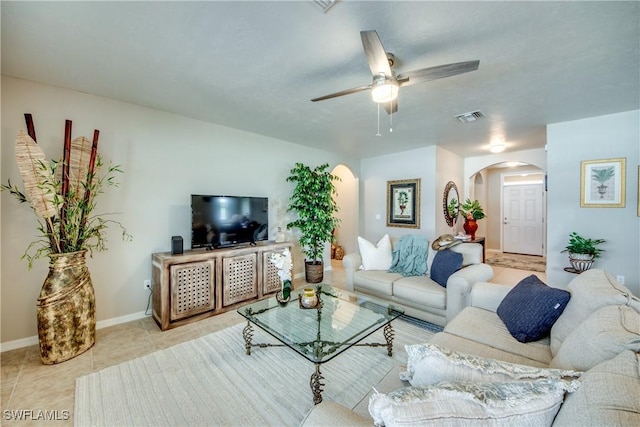 living room with light tile patterned floors and ceiling fan