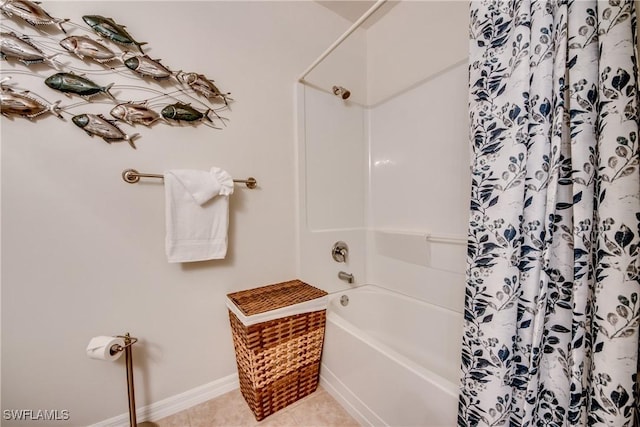 bathroom with shower / bath combo and tile patterned floors