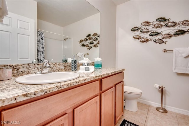 bathroom featuring tile patterned floors, curtained shower, vanity, and toilet