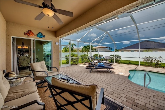 view of patio with an outdoor hangout area, a fenced in pool, glass enclosure, and ceiling fan