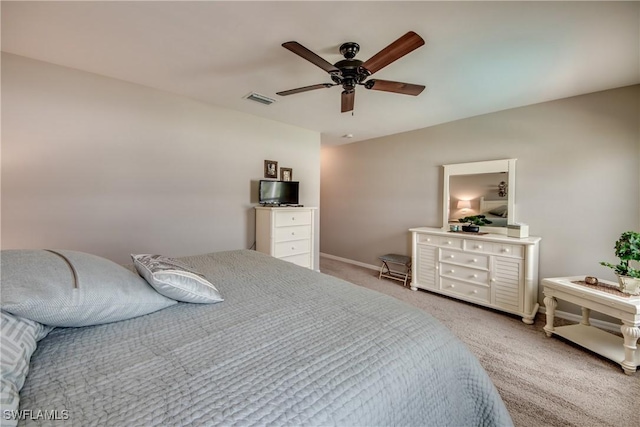 bedroom featuring ceiling fan and light carpet