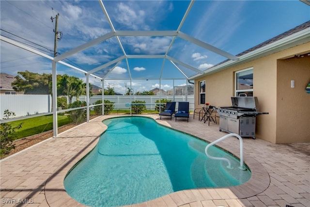 view of swimming pool featuring glass enclosure, area for grilling, and a patio