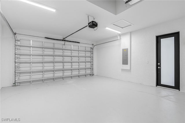 garage featuring a garage door opener and electric panel