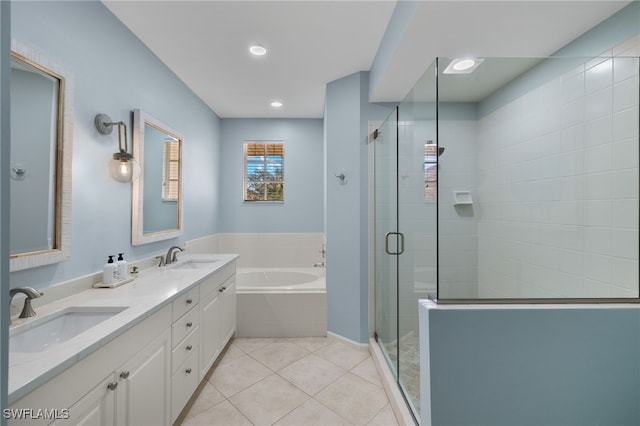 bathroom with tile patterned flooring, vanity, and independent shower and bath