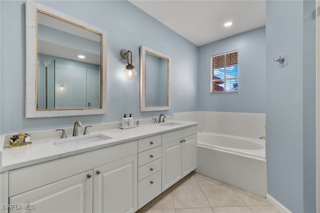 bathroom featuring tile patterned flooring, vanity, and independent shower and bath