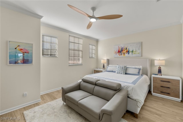 bedroom with ceiling fan, crown molding, and light hardwood / wood-style floors