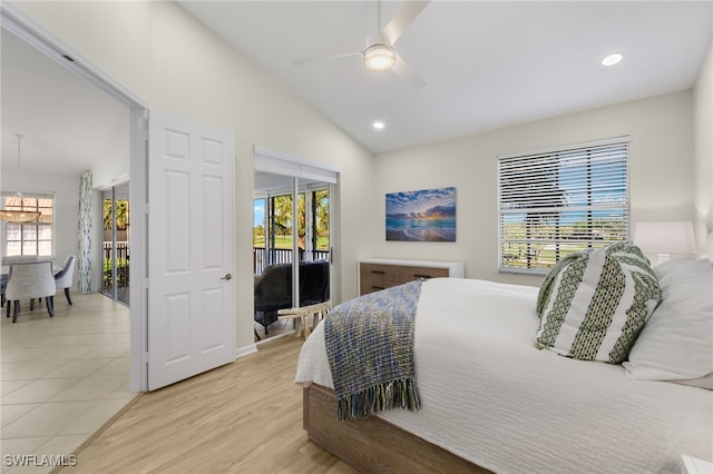 bedroom featuring access to outside, multiple windows, ceiling fan, and lofted ceiling