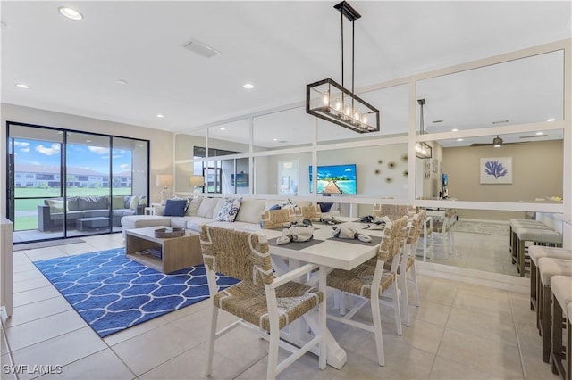 dining area with ceiling fan and light tile patterned flooring