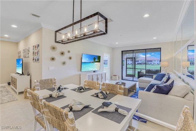 tiled living room with crown molding and a notable chandelier