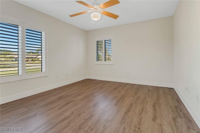 unfurnished room with ceiling fan and light hardwood / wood-style floors