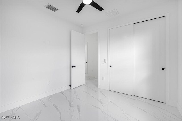 unfurnished bedroom featuring a closet and ceiling fan