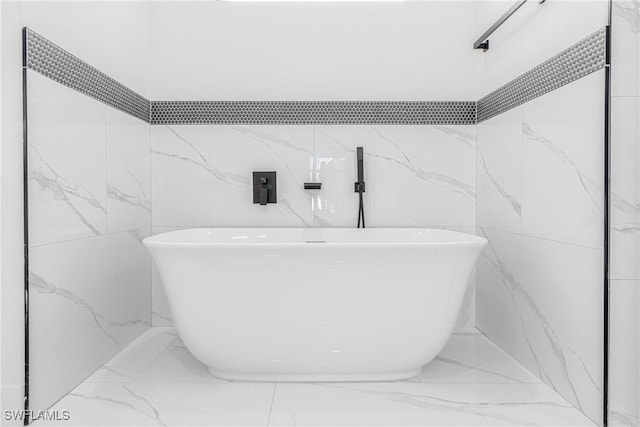 bathroom featuring a tub to relax in