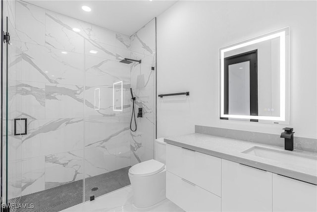 bathroom with toilet, vanity, and walk in shower