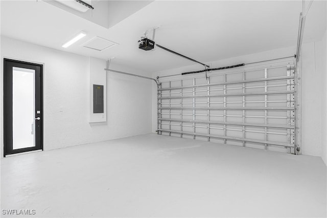 garage featuring a garage door opener and electric panel