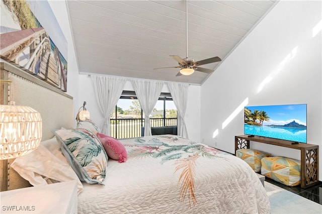 bedroom with access to exterior, vaulted ceiling, and ceiling fan