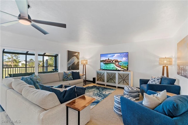 living room featuring carpet flooring and ceiling fan