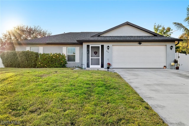 ranch-style house with a garage and a front yard