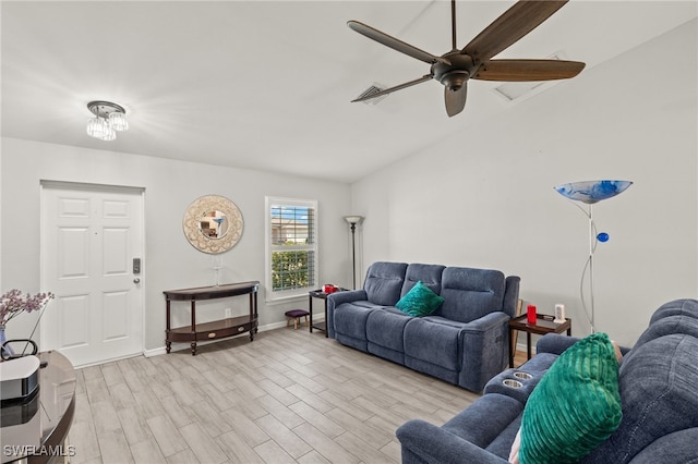 living room featuring lofted ceiling, ceiling fan, and light hardwood / wood-style flooring