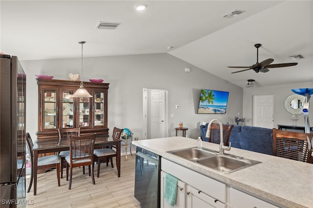 kitchen featuring sink, white cabinetry, hanging light fixtures, high quality fridge, and black dishwasher