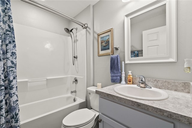 full bathroom with vanity, toilet, and shower / tub combo