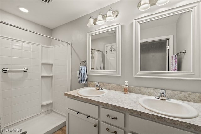 bathroom featuring vanity and a shower with curtain